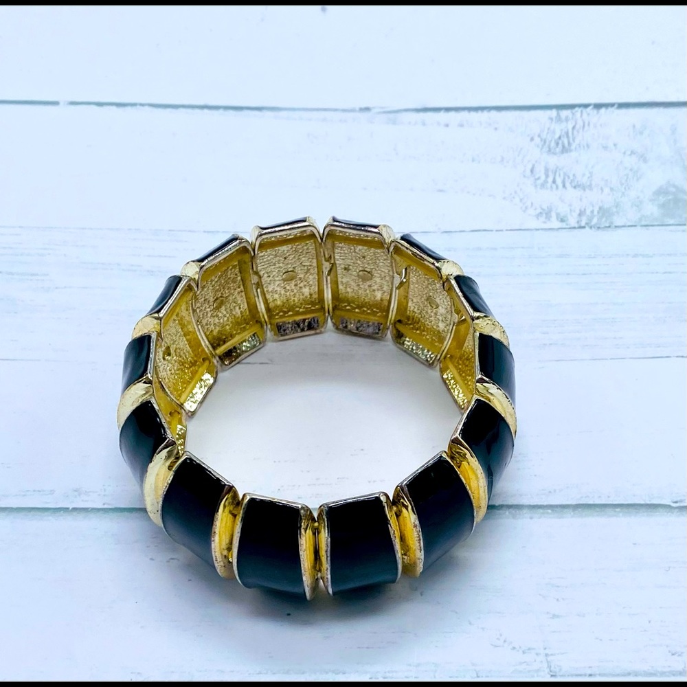 Black and gold tone bracelet